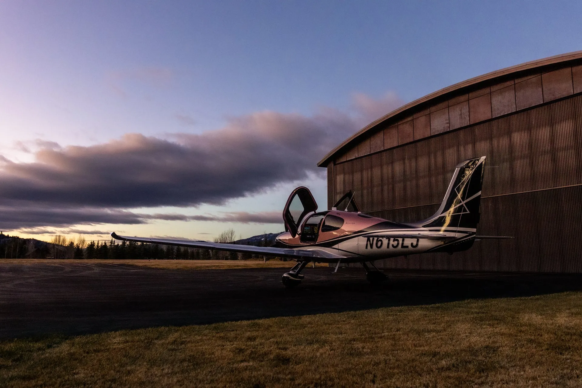 Aircraft wing against a dusk sky during evening operations